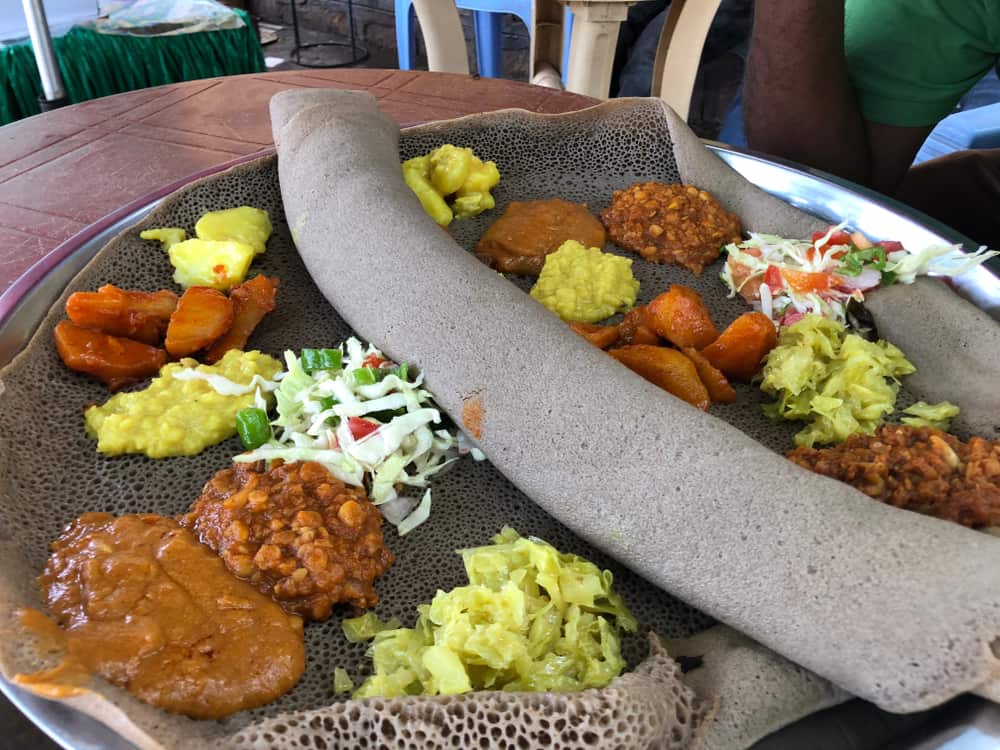 injera teff flatbread with curries 