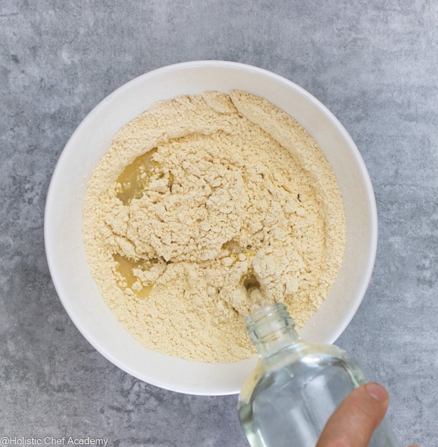 Adding water to the chickpea socca flatbread batter