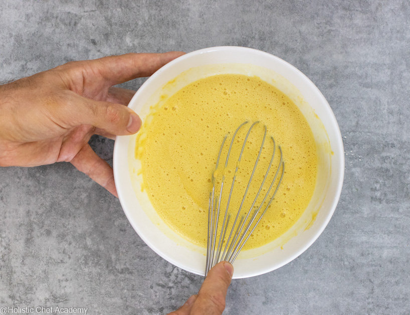 Whisking the chickpea socca flatbread batter