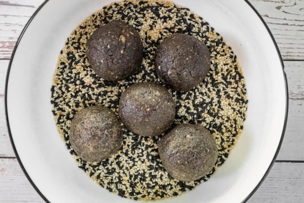 add-the-bliss-balls-to-tosted-sesame-seeds