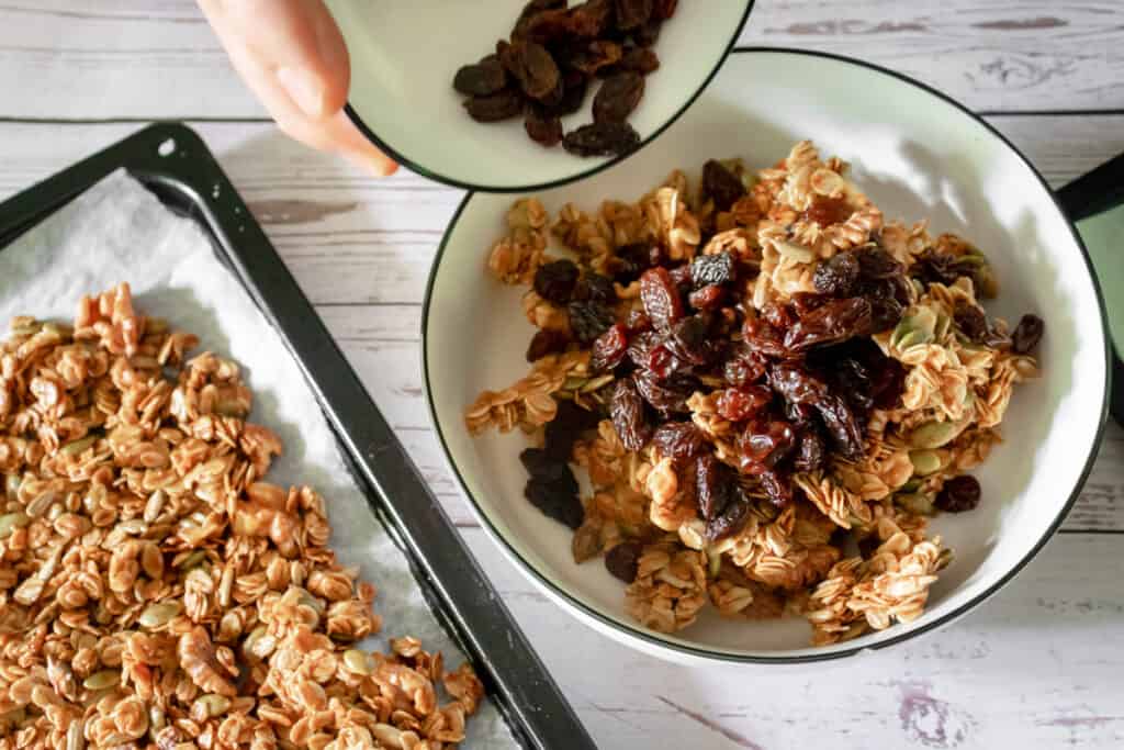 adding-raisins-to-granola