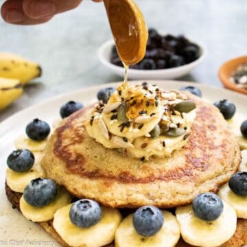 vegan-banana-pancakes-getting-drizzled-with-honey