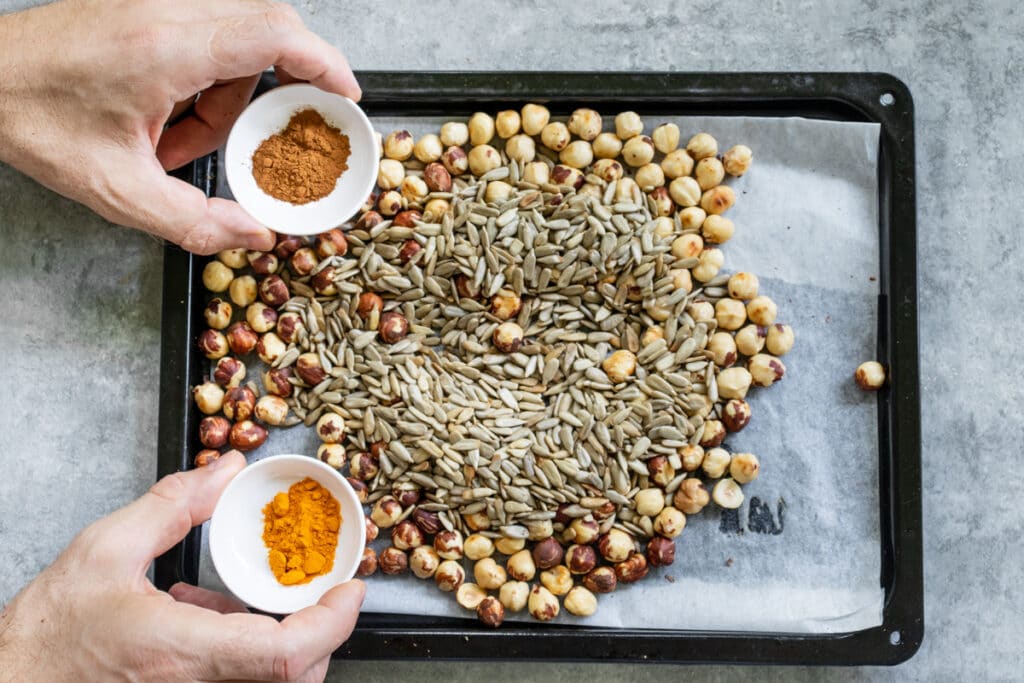 adding-spices-to-hazelnuts-and-sunflower-seeds