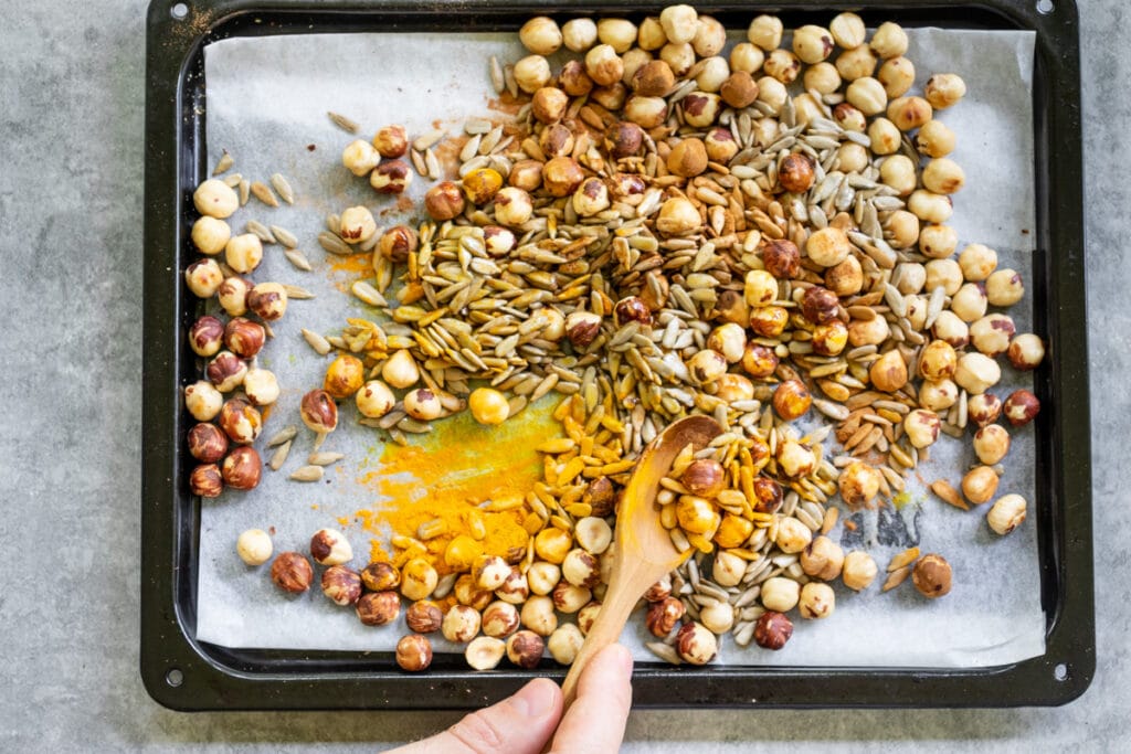 roasting-hazelnuts-and-sunflower-seeds-on-a-baking-tray