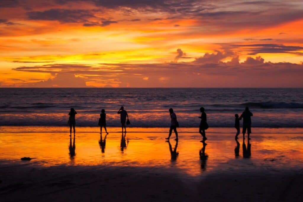 Phuket-sunset-with-people-on-the-beach