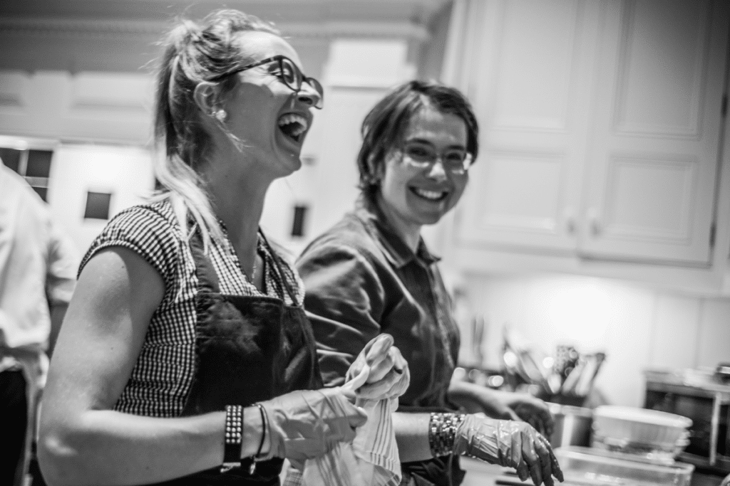 happy-team-laughing-while-cooking