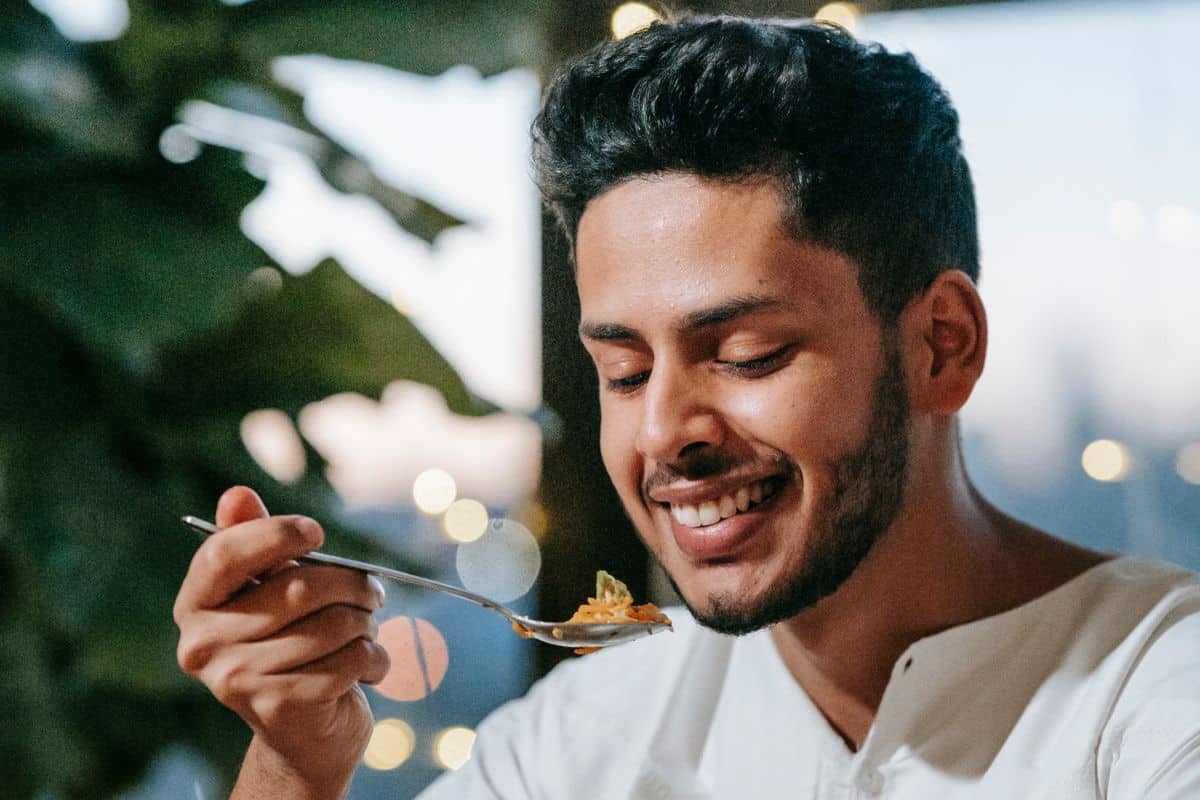 man-savouring-his-food-with-happinness