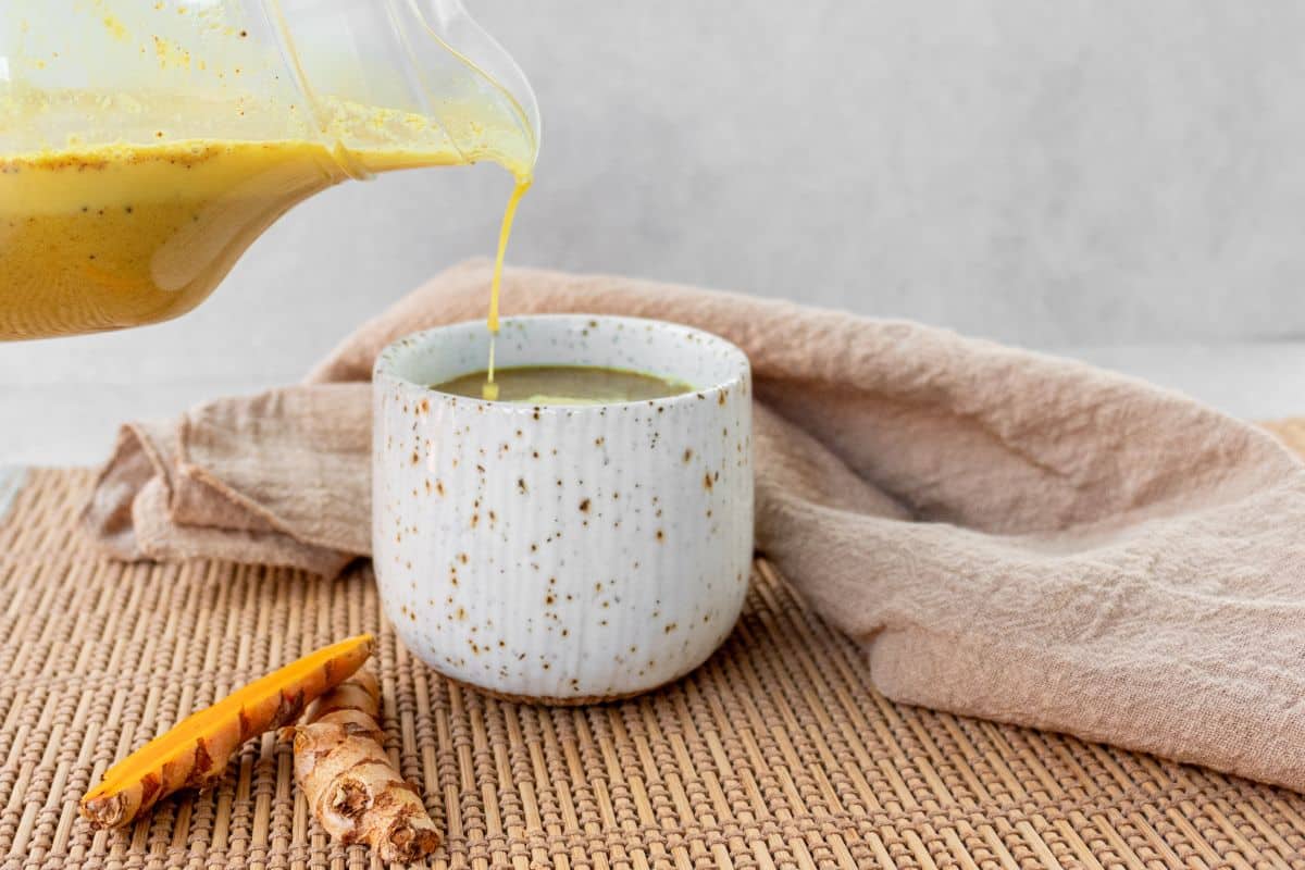 pouring-golden-milk-into-a-mug