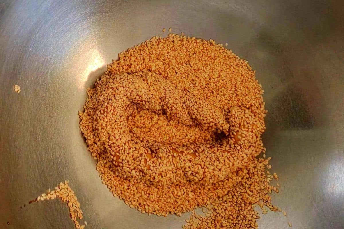 coat the simit in toasted white sesame seeds
