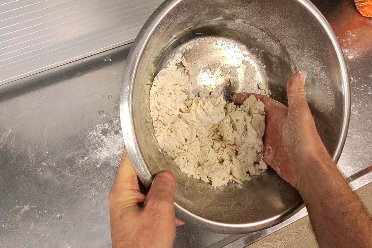Smooth elastic simit dough in a bowl after kneading and rising