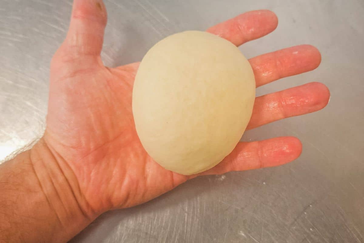 roll-each-bazlama-dough-ball-into-90-100g-sizes
