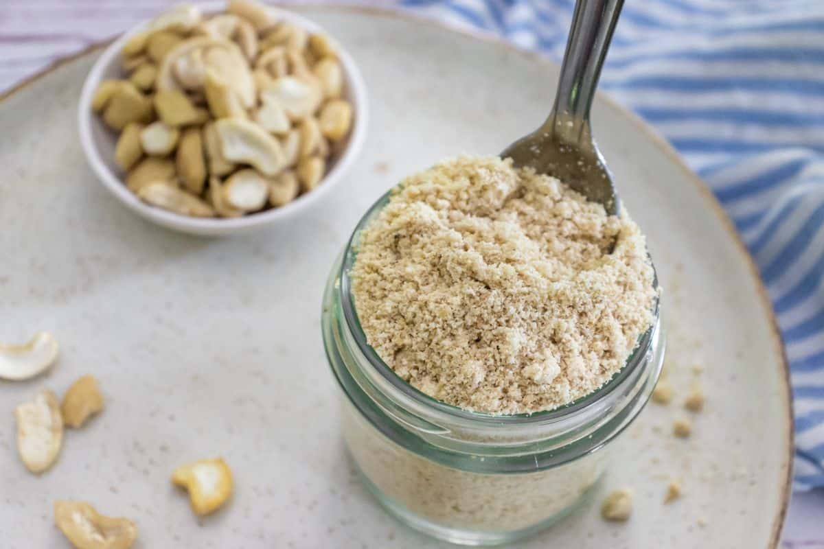 Toasted cashews, nutritional yeast, garlic powder and pink salt ready to make vegan Parmesan.