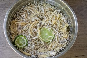 Banana-Blossom-Salad-Step-by-step-2-Peeled-sliced-and-soak-banana-blosso.jpg
