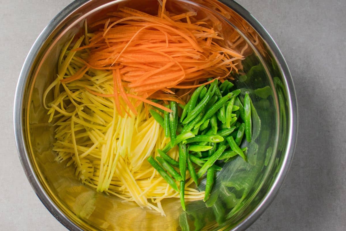 Mango-Salad-Step-By-Step-10.-Add-carrot-in-the-mixing-bowl.