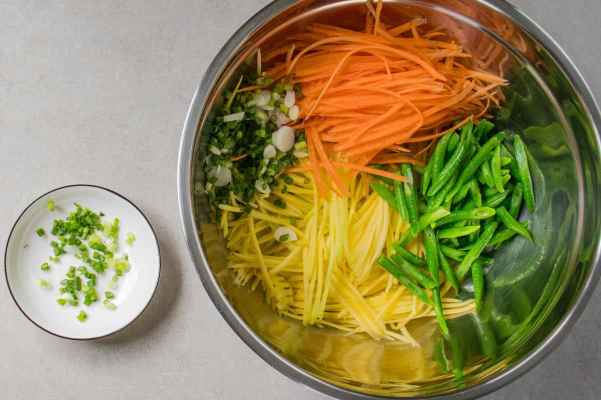 Julienned green mango and carrot prepared for Thai salad