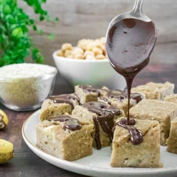 chickpea blondies drizzled with homemade chocolate sauce