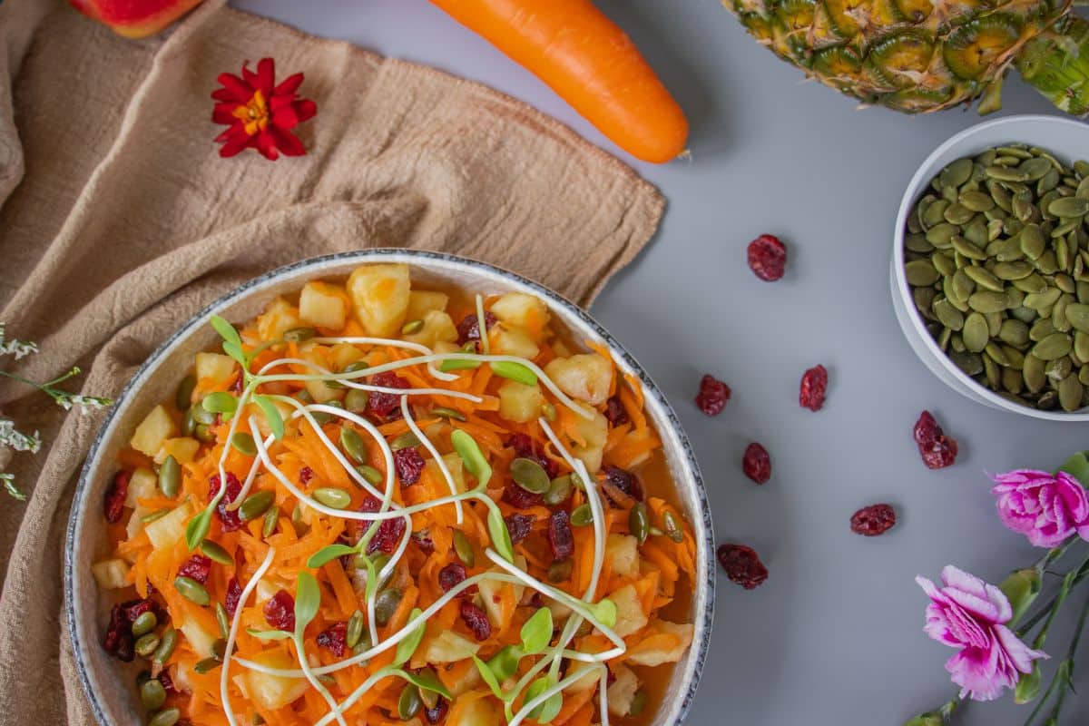 Fresh plant-based carrot pineapple salad served as a colourful side dish