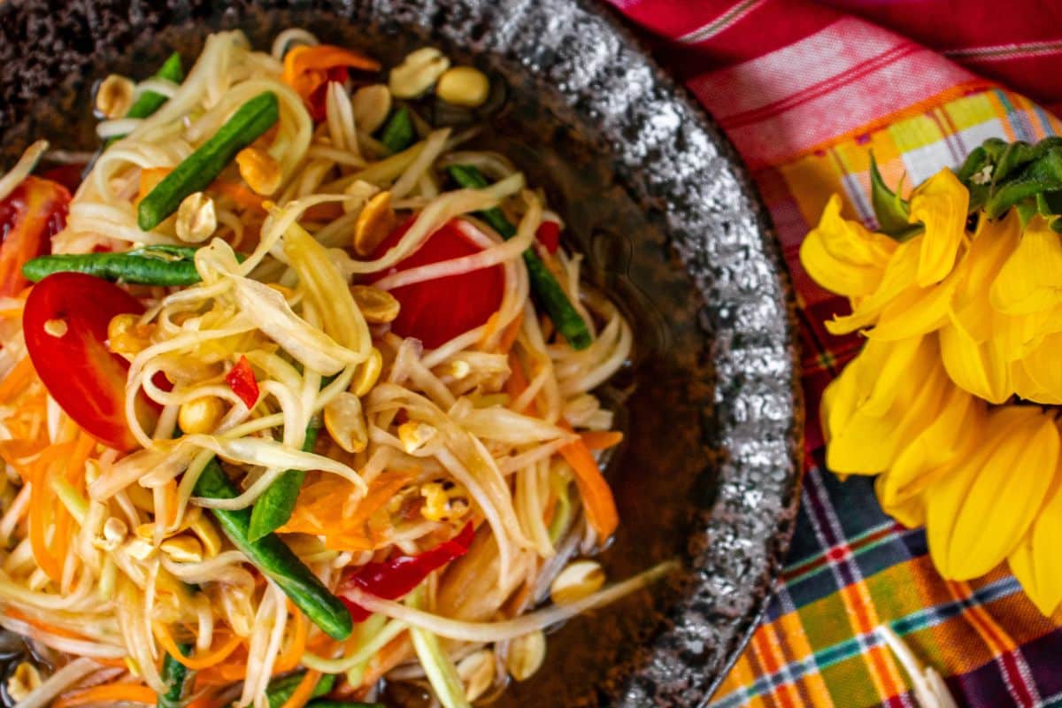 Thai green papaya salad served fresh with lime, chilli and peanuts.