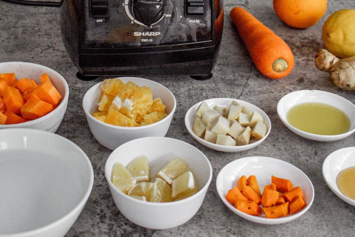 Turmeric-Wellness-Shot-Step-by-Step-1-Cut-all-the-raw-ingredients