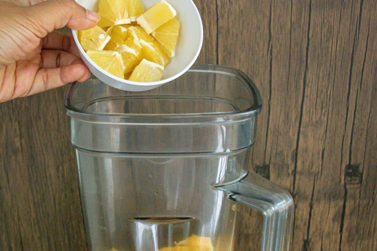 Turmeric-Wellness-Shot-Step-by-Step-5-_-Add-lemon-into-a-blender