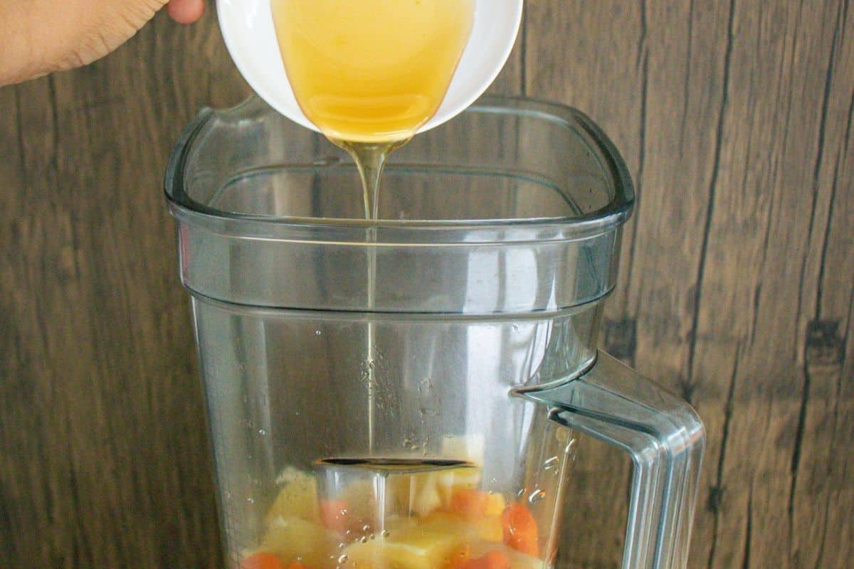 Turmeric-Wellness-Shot-Step-by-Step-8-_-Add-coconut-syrup-into-a-blender