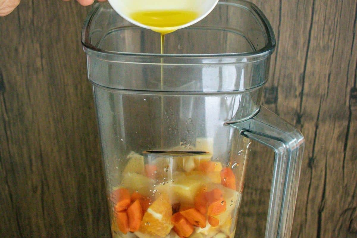 Turmeric-Wellness-Shot-Step-by-Step-9-_-Add-olive-oil-into-a-blender