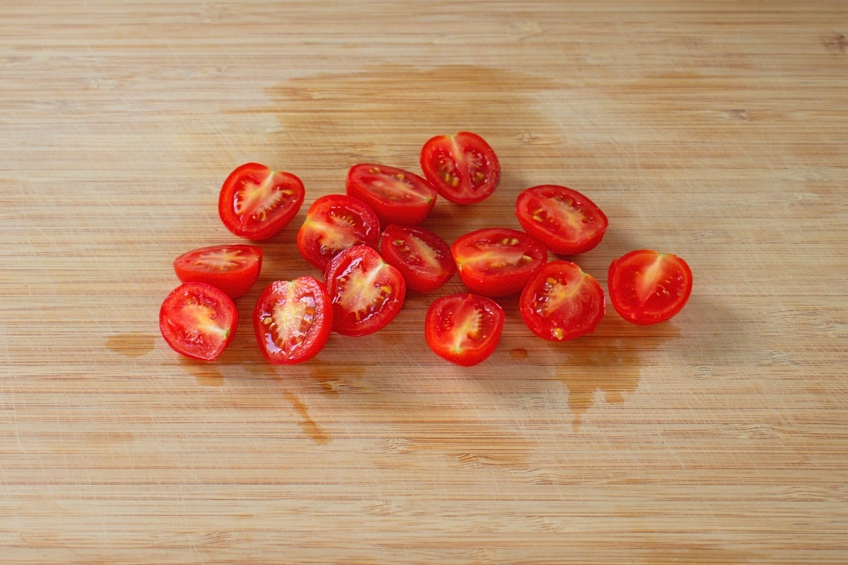 Cherry tomatoes halved and quartered for Burmese Tea Leaf Salad