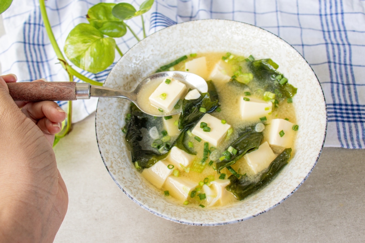 Homemade miso soup with soft tofu and wakame seaweed