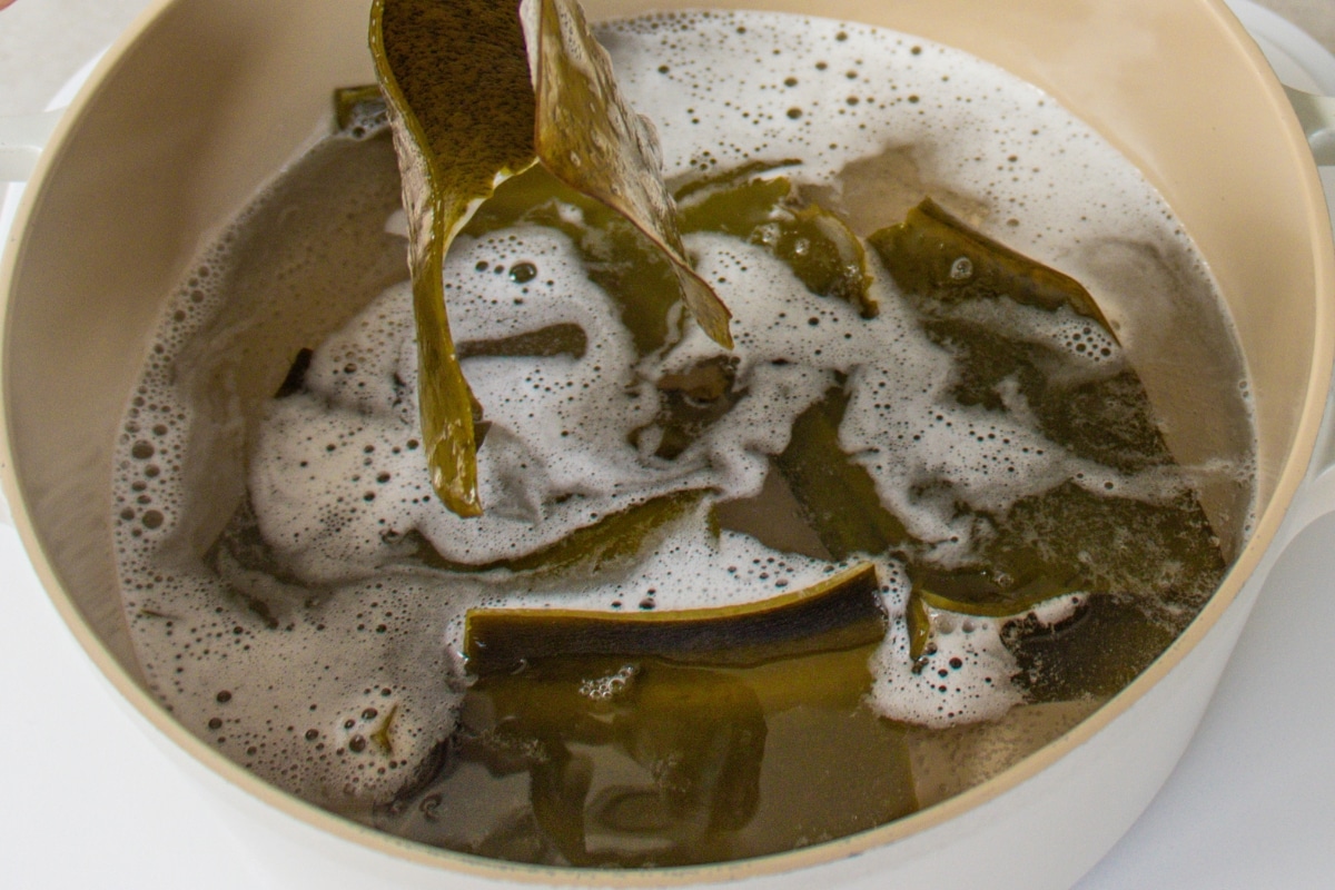 Remove the kombu - Once the broth has developed its flavour, carefully remove the kombu from the pot.