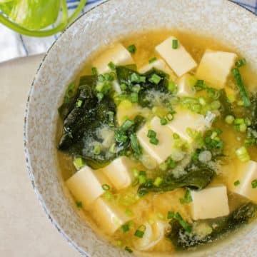 Traditional Japanese miso soup with tofu, wakame seaweed and spring onions