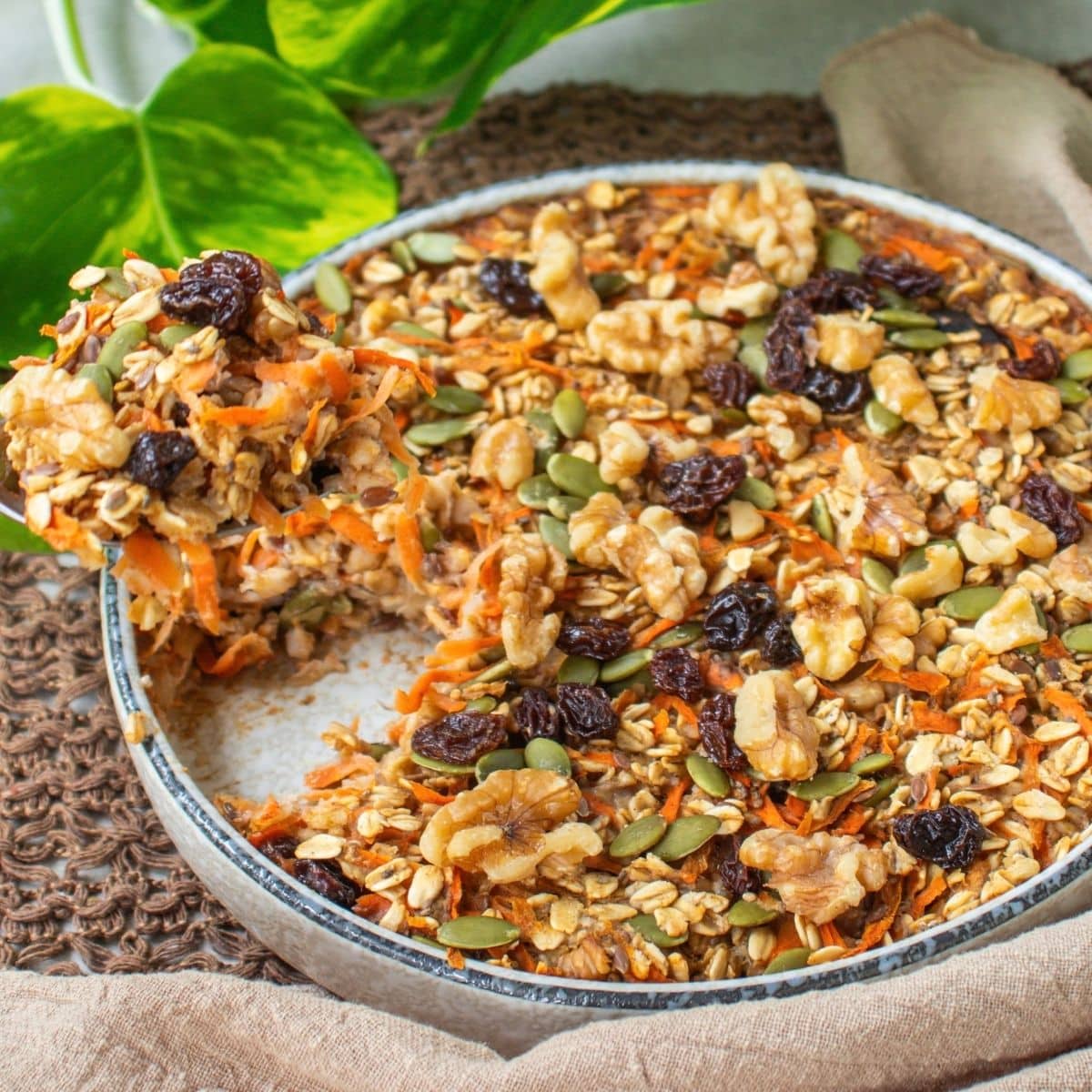 Carrot cake baked oatmeal with grated carrot, walnuts, raisins and warming spices.